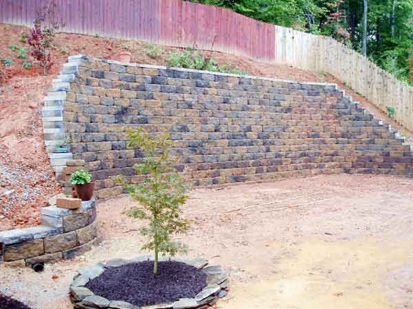 A high retaining wall, as well as the start of some landscaping