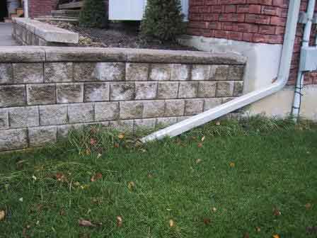 An extended downspout to carry water away from this house