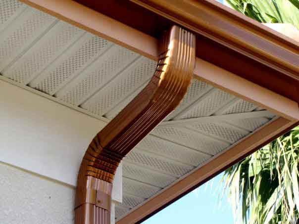 Shiny seamless gutter system with a downspout, and new soffeting as well!