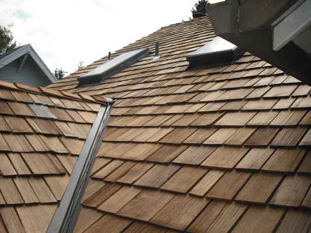 Cedar roof shingles amidst double skylights